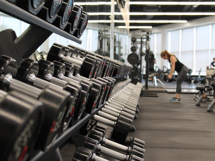 Dumbbell rack in a bright commercial gym